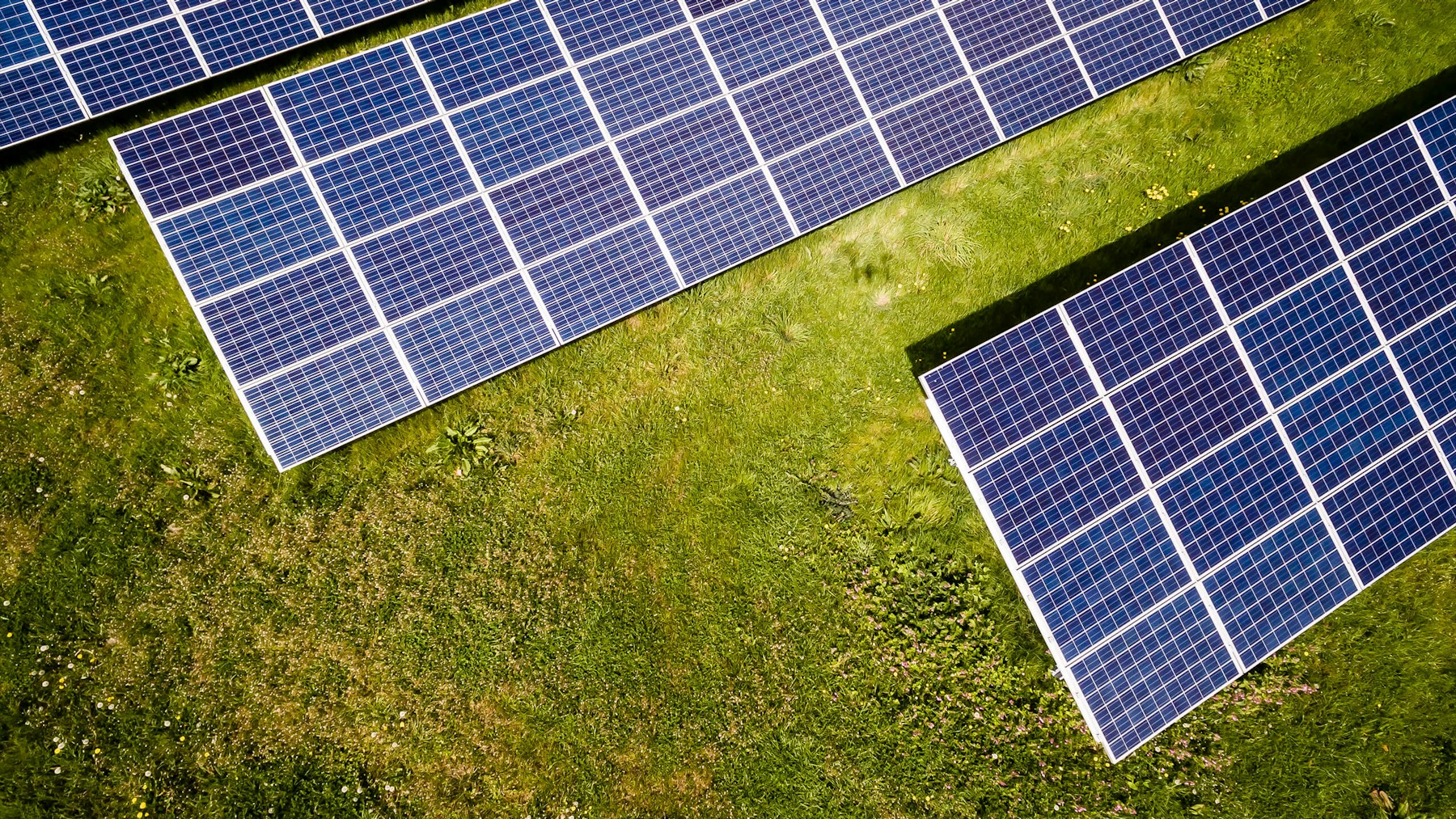 Rooftop photovoltaic panels arranged in rows on a completed solar installation